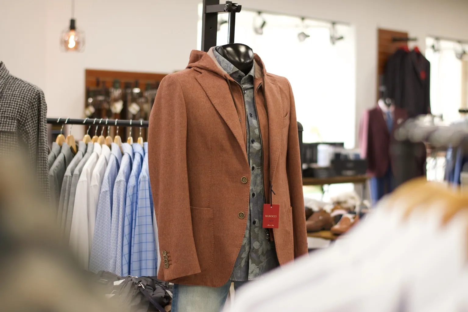 Rust hooded jacket on display at Jason Louis Mequon